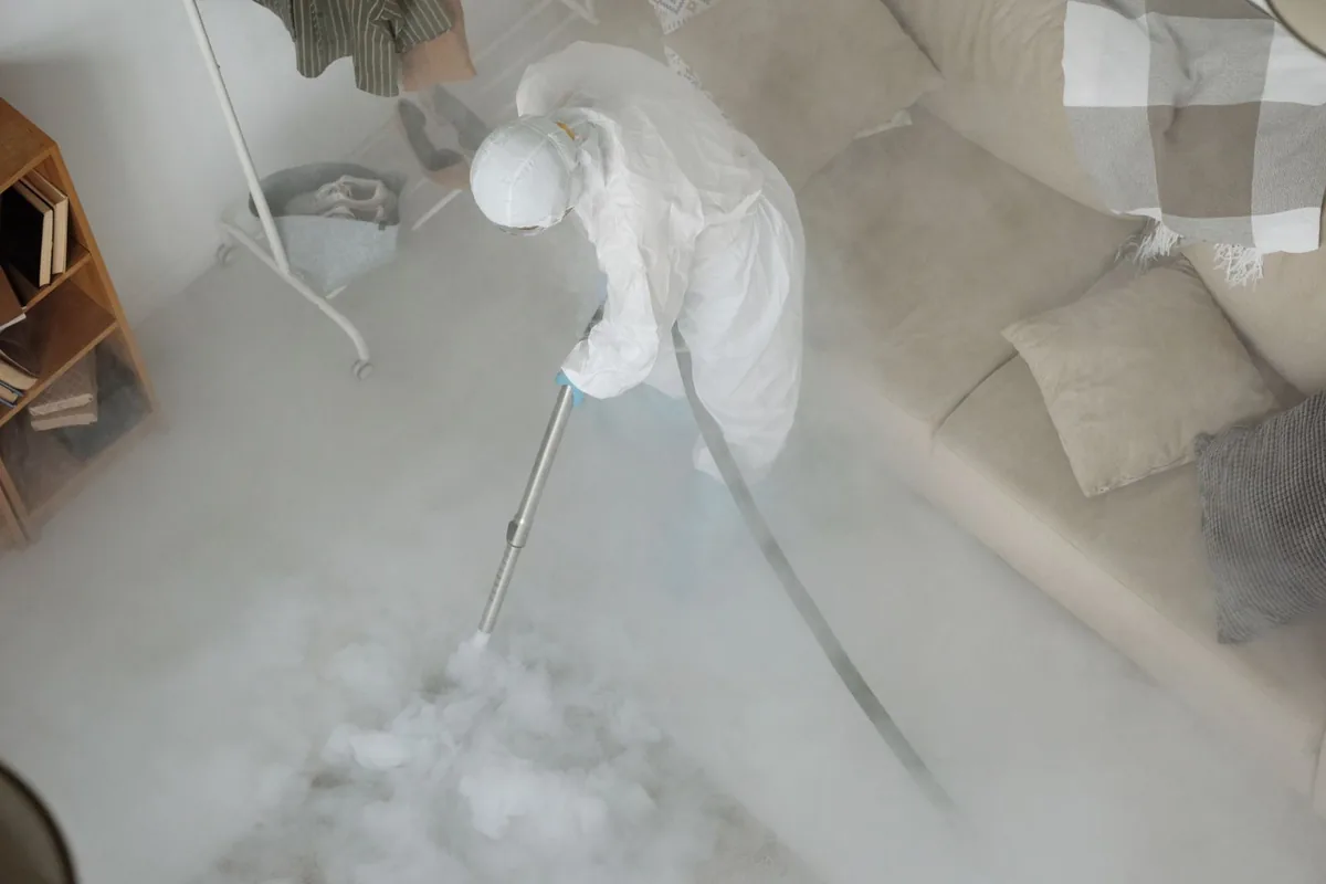 Biohazard cleanup technician in protective equipment, Ridgemark, CA